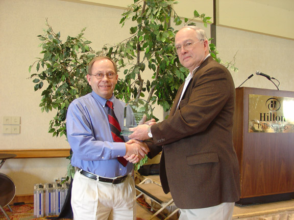 Photo caption Larry Simonson, Tau Beta Pi (left) accepts the award from CMC Chair, Ray Morrison.